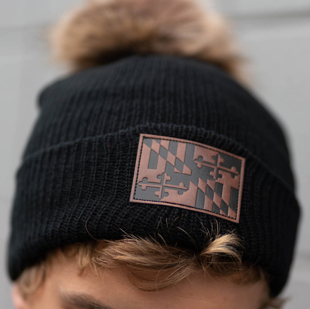 
            
                Load image into Gallery viewer, Maryland Flag Leather Patch (Black w/ Fur Pom) / Slouchy Knit Beanie Cap - Route One Apparel
            
        